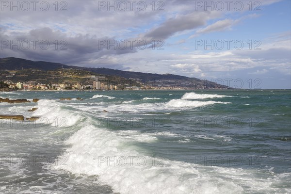 Strong swells during storm break on seawall in Sanremo