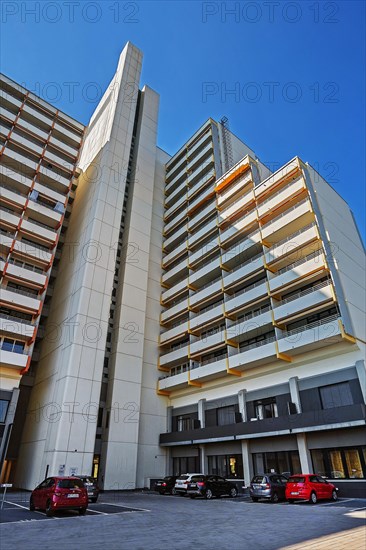 High-rise building with concrete balconies