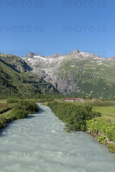 Landscape of the Rhone Valley with the Rhone River in front of the massif of the Rhone Glacier