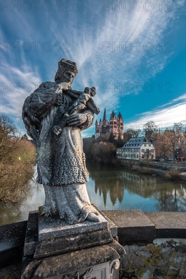 Limburg Cathedral from the Old Bridge with statue of St. John of Nepomuk at sunrise