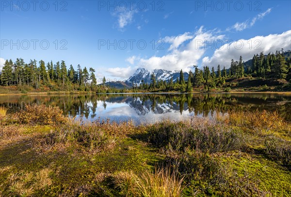 Mt. Shuksan glacier with snow reflecting in Picture Lake