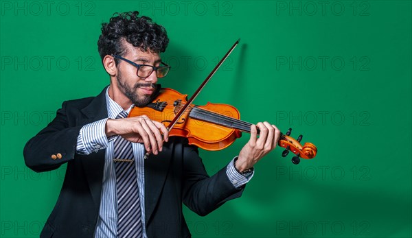 Attractive young man playing violin