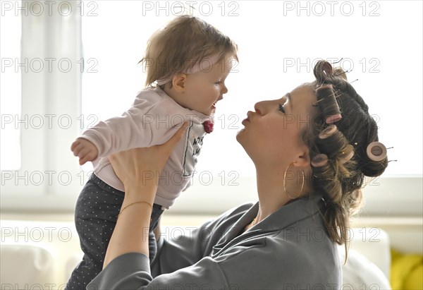 Mother with curlers in her hair