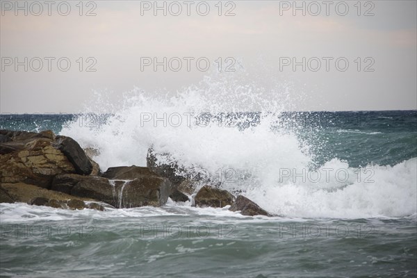 Strong swells during storm break on seawall in Sanremo