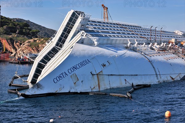 Bow with lettering name Costa Concordia of capsized cruise ship