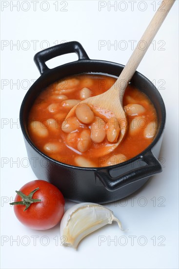 White beans with tomato sauce in pots