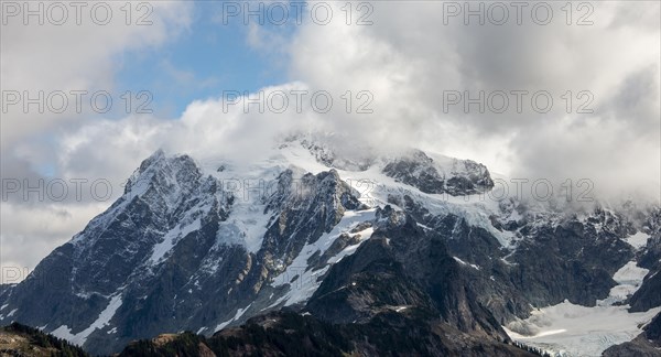 Cloudy mountain with snow and glacier