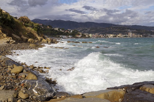 Strong swells during storm break on seawall in Sanremo