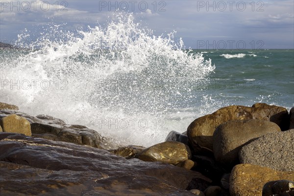 Strong swells during storm break on seawall in Sanremo