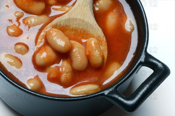 White beans with tomato sauce in pots