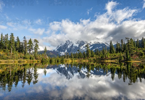 Mt. Shuksan glacier with snow reflecting in Picture Lake