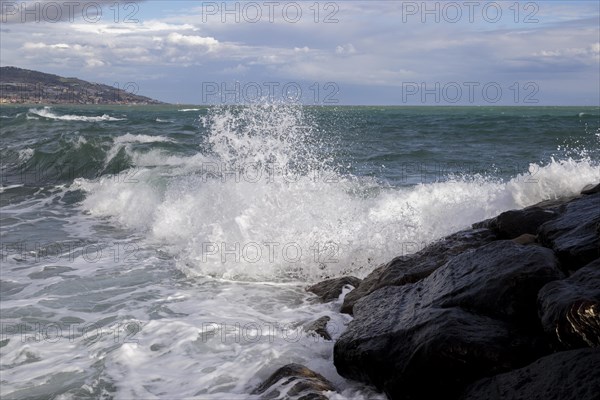 Strong swells during storm break on seawall in Sanremo