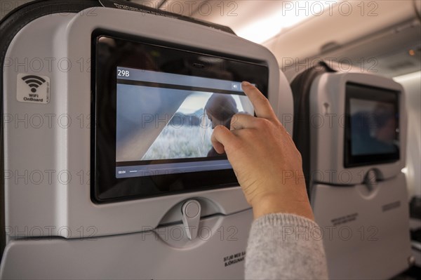 Hand operates computer screen