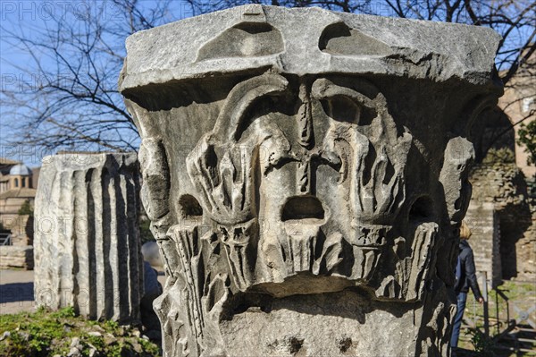 Fragment of capital of column with head with stylised cry