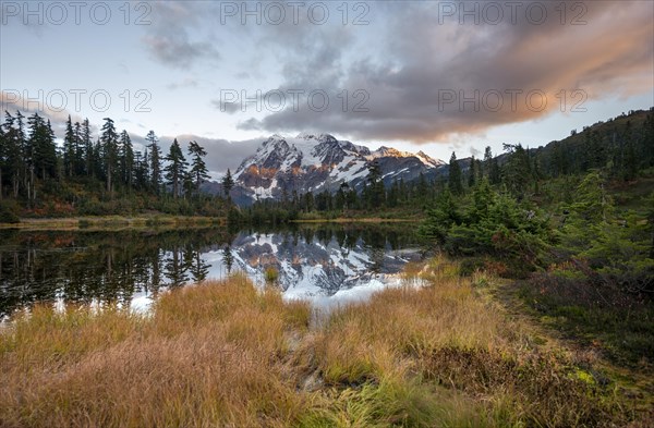 Mt. Shuksan glacier with snow reflecting in Picture Lake