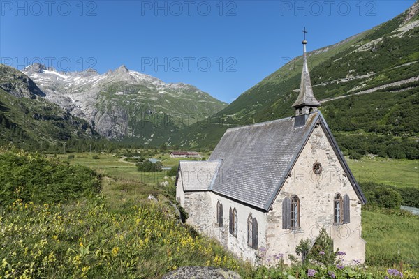 Landscape of the Rhone Valley in front of the Rhone Glacier and the Anglican Chapel in the hamlet of Gletsch