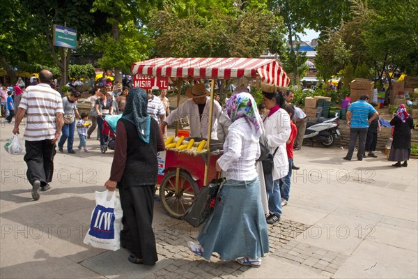 Bazaar street with corncob seller