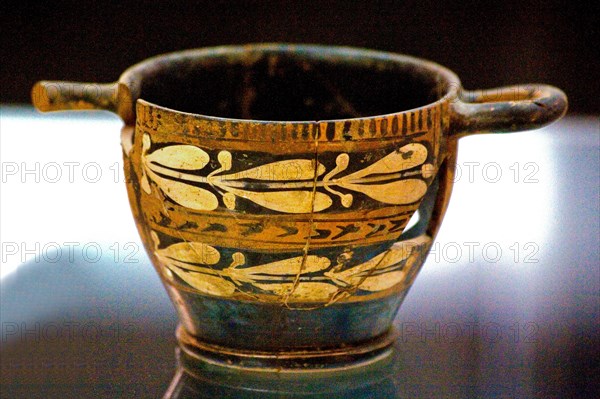 A scyphos is the name given to an ancient Greek drinking bowl with a low foot and two horizontal handles