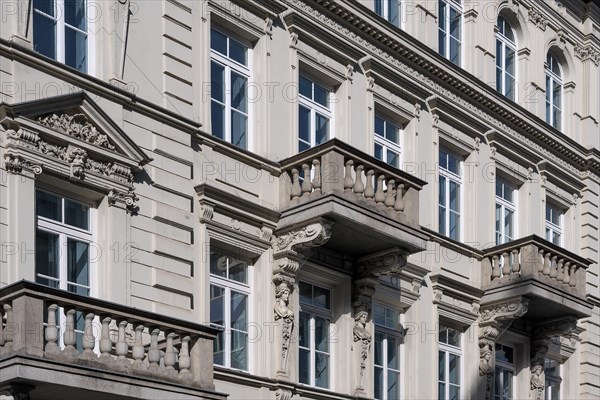 Classicist facade with balconies and caryatids