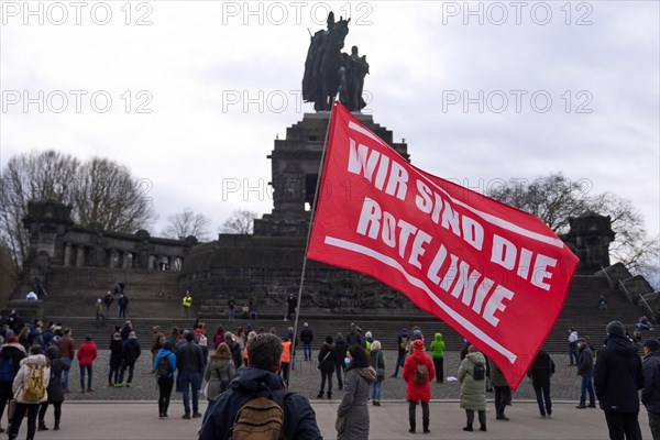 Opponents of the Corona measures demonstrate with flags and banners at the Deutsches Eck in Koblenz