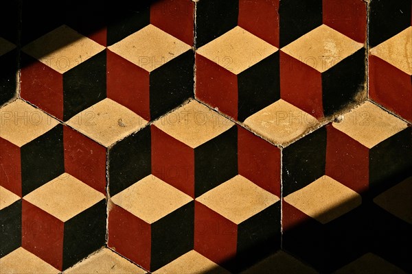 Old tile floor with mosaic pattern