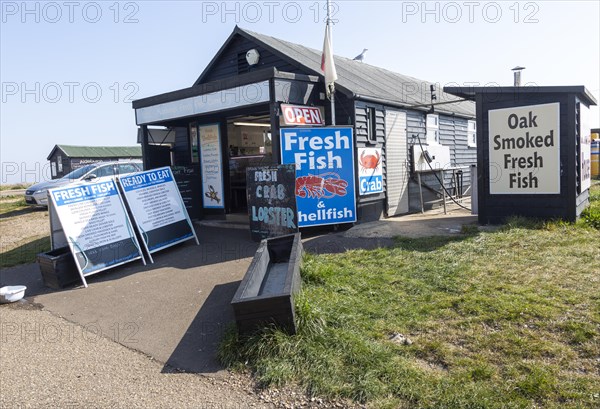 Beach fishmonger shop selling fresh and smoked fish