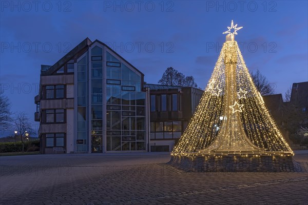Christmas decorated fountain in front of the town hall Eckental