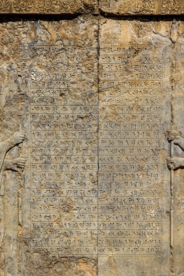 Persian guards at the west staircase of Darius Palace with cuneiform writing