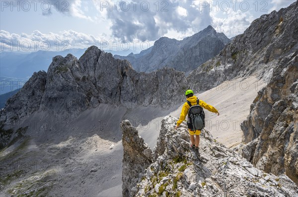 Hiker balancing on rocky outcrop