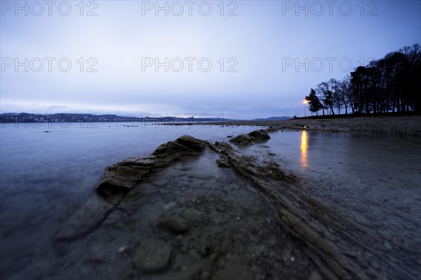 Storm warning light in the morning during a storm at Lake Constance