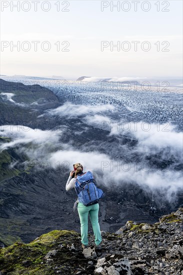 Hiker looks over spectacular landscape