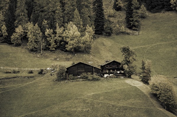 Old farms on mountain meadow