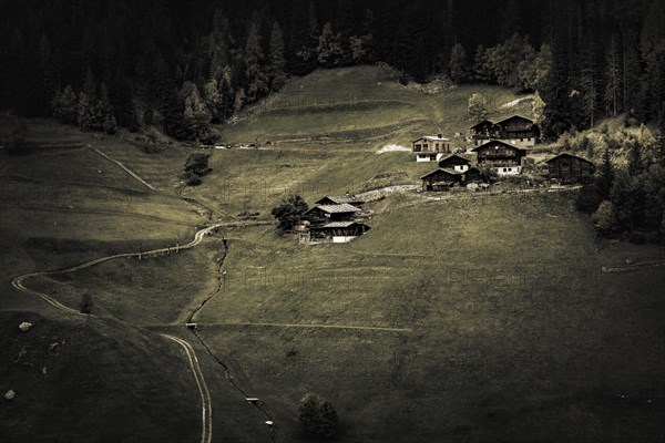 Old farms on mountain meadow