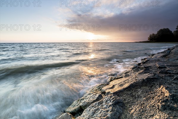 Morning atmosphere with light wind and waves Bank stabilisation in the harbour of Guettingen