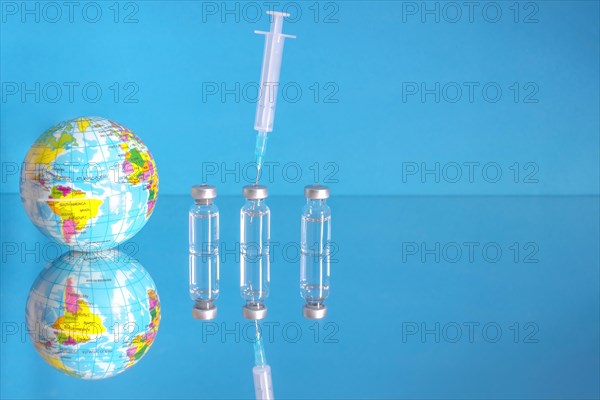 Vaccine bottles and syringe