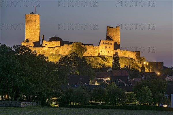 Illuminated castle ruins of the medieval Stauferburg Muenzenberg