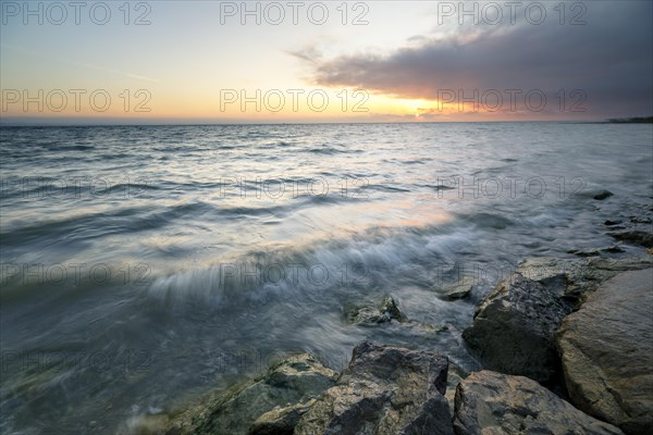 Morning atmosphere with light wind and waves Bank stabilisation in the harbour of Guettingen