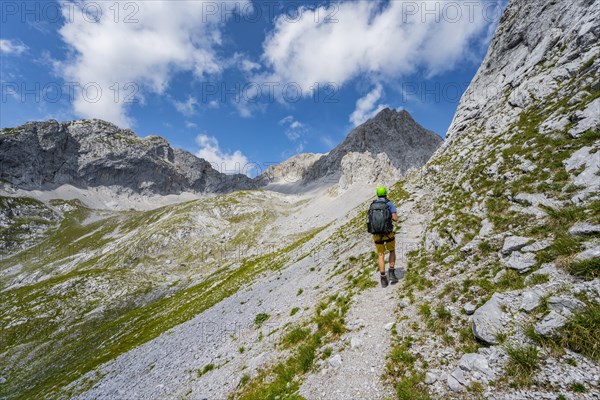 Hiker on hiking trail to Lamsenspitze