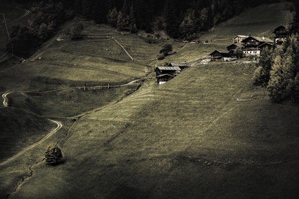 Old farms on mountain meadow