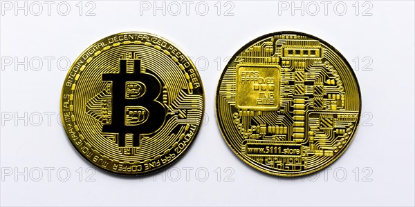 Bitcoin BTC crypto currency gold coins on white background