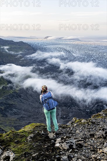 Hiker looks over spectacular landscape