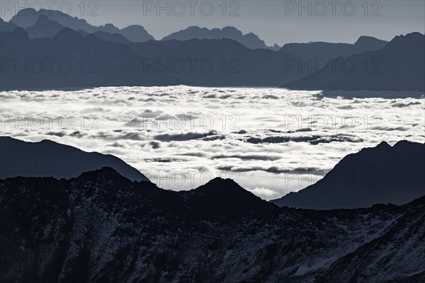 Haze in the valley with South Tyrolean mountains at blue hour