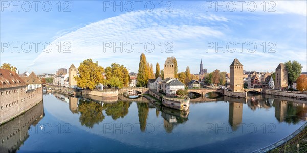 Petite France bridge over river Ill water with tower panorama text free space Copyspace Alsace in Strasbourg