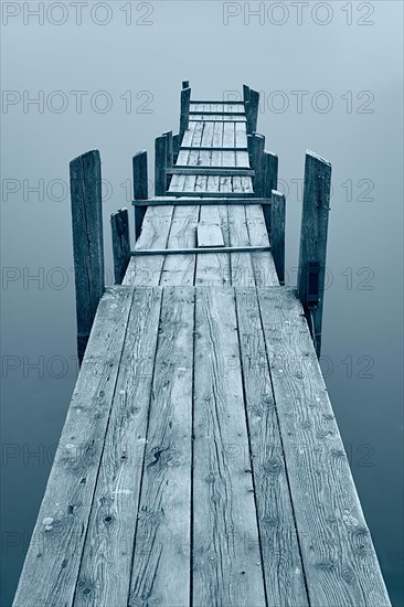 Jetty at Diessen am Lake Ammer with fog