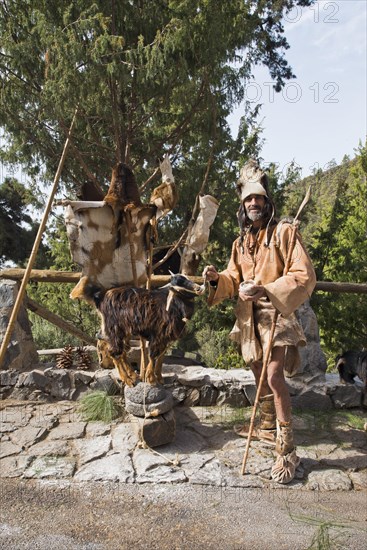 Goat herder in traditional garb