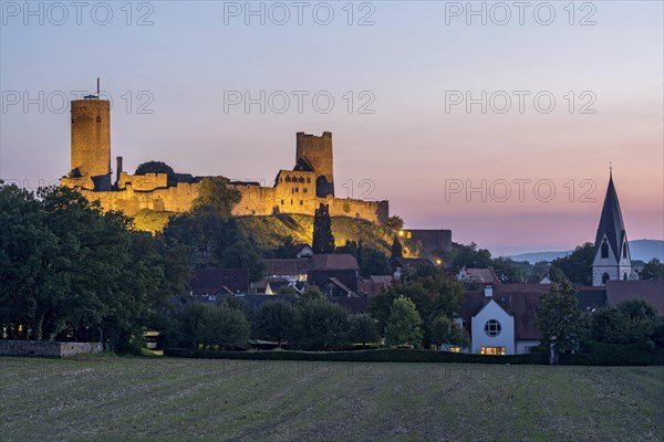 Illuminated castle ruins of the medieval Stauferburg Muenzenberg