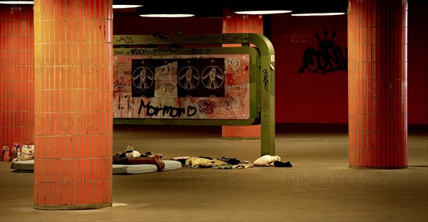 Sleeping homeless man in the pedestrian subway at the Congress Centre ICC in Charlottenburg