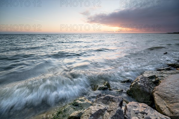 Morning atmosphere with light wind and waves Bank stabilisation in the harbour of Guettingen