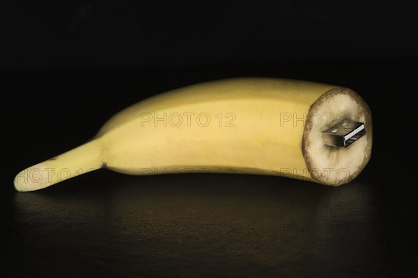 USB stick stuck in a cut banana