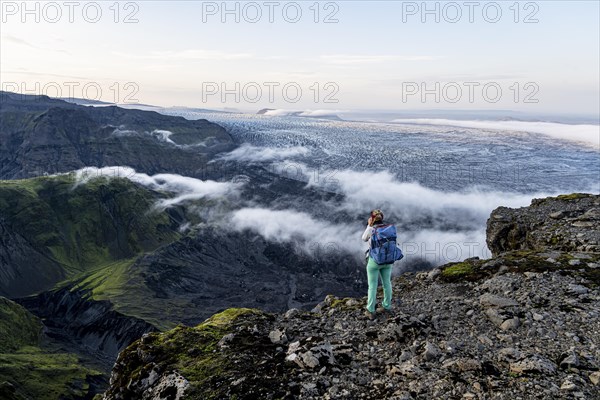 Hiker looks over spectacular landscape